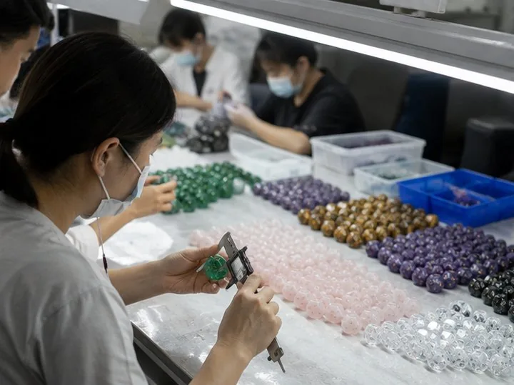 CuiShen quality team measuring and sorting gemstone dice